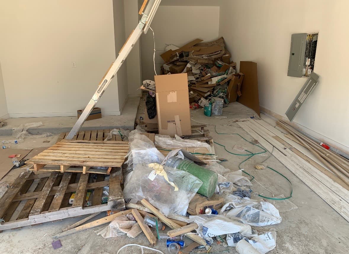 Garage before construction debris cleanup in Lubbock, Texas
